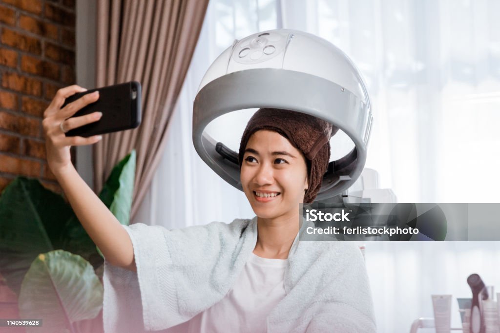 Woman Taking Selfie While Getting Treatment Stock Photo - Download Image  Now - Steamer, Hair, Professional Occupation - iStock