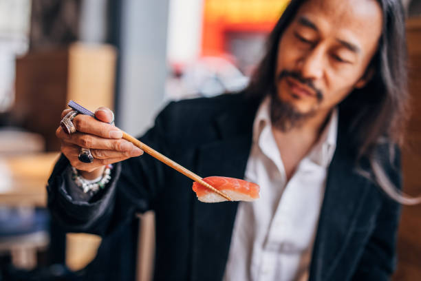 istock Gentleman loves sushi 1140539667
