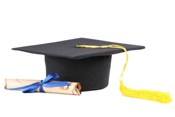 istock Graduation cap with diploma isolated on white background 1140540575