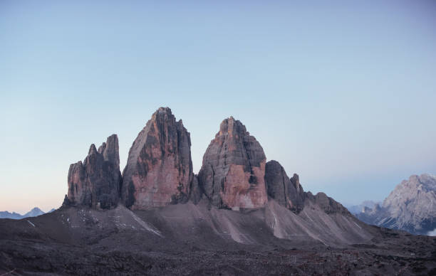 istock Three peaks Tre Cime mountains in the morning with clear sky over it 1140542028