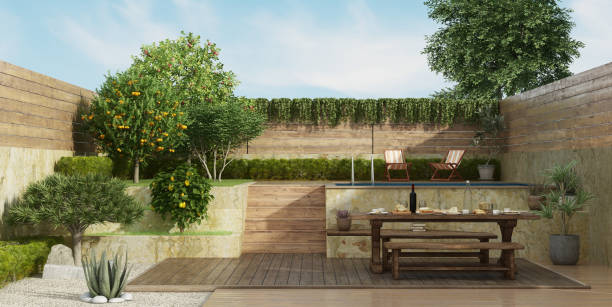 istock Garden on two levels with old dining table on deck floor 1140542091