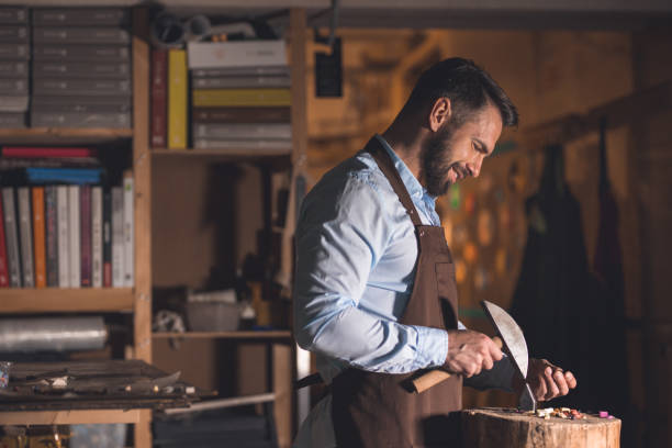 istock Mature man with a mosaic at work 1140542787