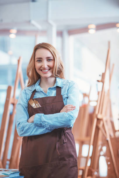 istock Young attractive artist at the easel 1140543391