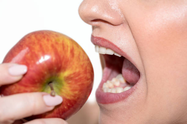 istock Woman biting an apple 1140543598