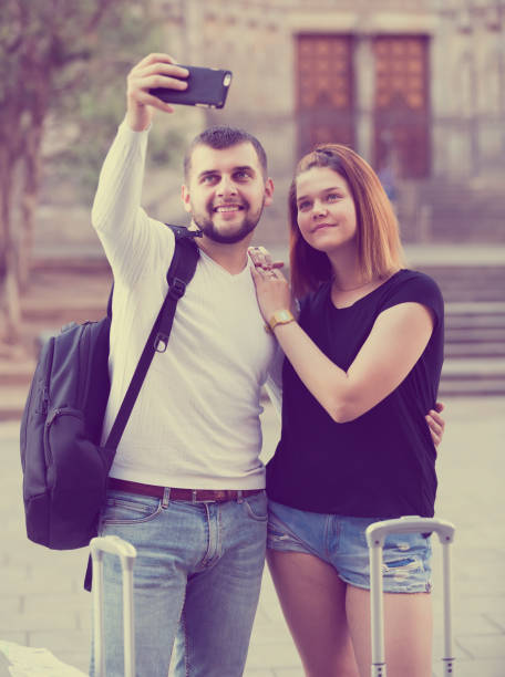 istock young female and male taking selfie 1140543999