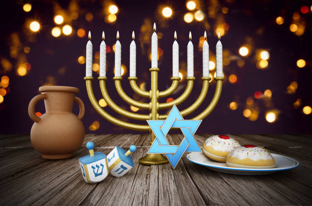 Hanukkah collection with candles, star, donuts, dreidels on the table against bokeh light background.