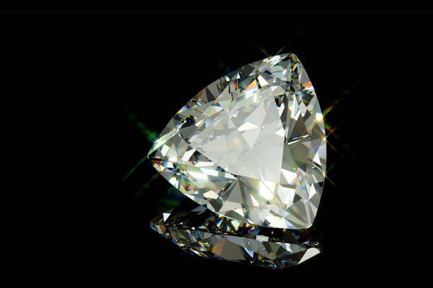 istock Sparkling trilliant diamond on black glossy background 1140547369