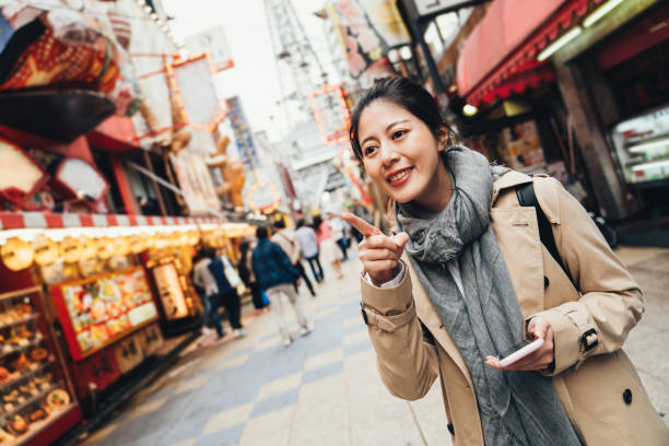 istock traveler cheerfully pointing to destination 1140547517