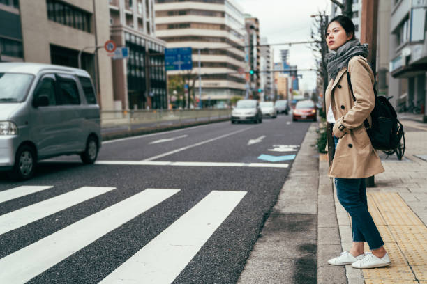 istock people walking waiting for traffic lights 1140547534