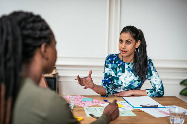 millennial financial advisor talking to client. indian leader in business. - dutch ethnicity imagens e fotografias de stock