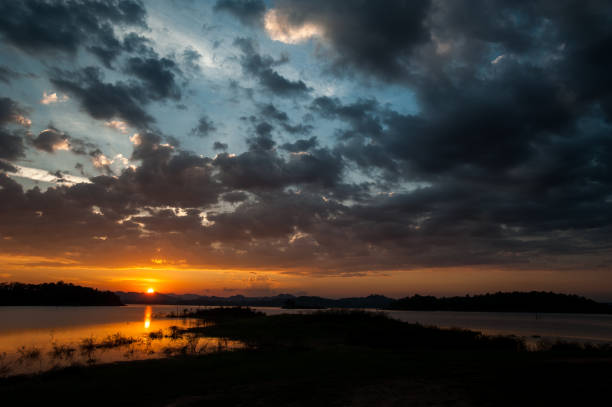 istock colorful dramatic sky with cloud at sunset. over silhouette mountains 1140548813