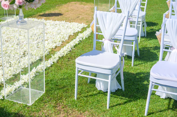Chair decorated with flowers in Wedding ceremony.