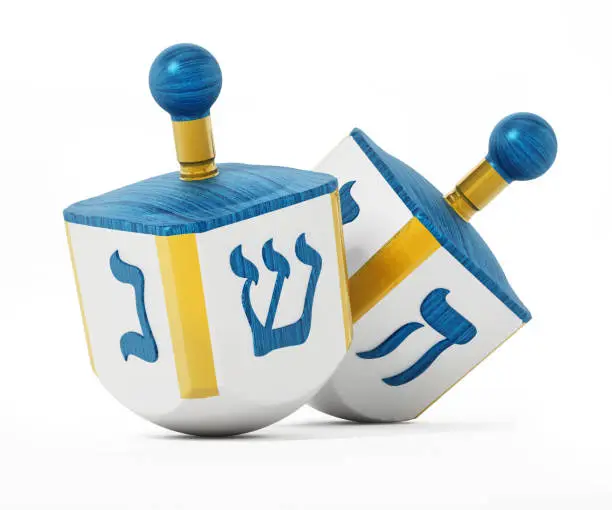 Hanukkah dreidels isolated on white.