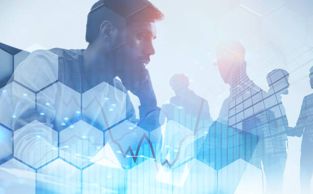 istock Pensive man with laptop and team, graph 1140551021