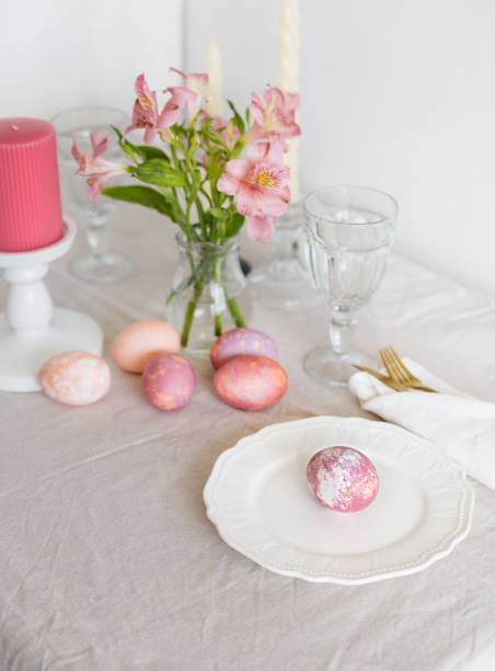 istock Beautiful festive Easter table setting with linen napkin and Alstroemeria flowers 1140551636