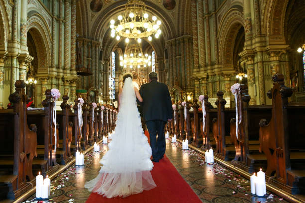 istock Father guiding his daughter to the altar. 1140552284