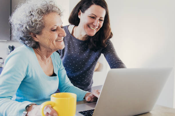 istock Cheerful mother and daughter doing shopping online 1140552581