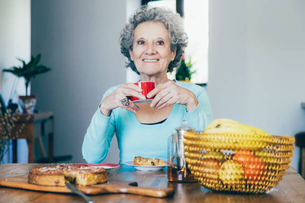 istock Joyful happy retired lady celebrating birthday 1140552598