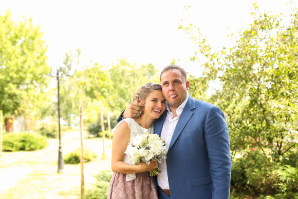 istock Happy engament couple posing in nature 1140552687
