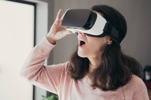 istock Shocked young woman with open mouth watching video 1140553469