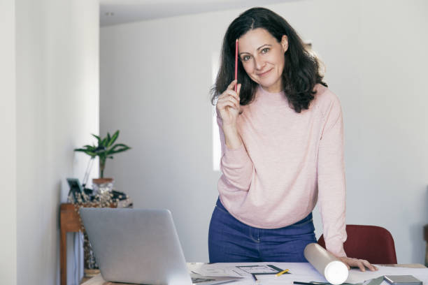 istock Positive confident building designer at her workplace 1140553526