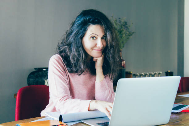 istock Positive smiling freelance designer working on project 1140553538