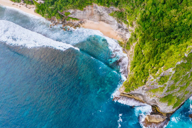 istock Blue ocean and cliffs. Bali shores from above. Aerial drone shot. 1140553549