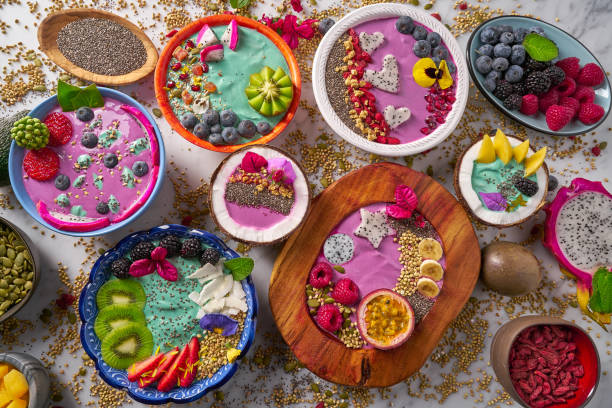 Acai bowl smoothie and Spirulina algae with berries Acai bowl smoothie and Spirulina algae with chia berries seeds and fruits mix dragon fruit flower stock pictures, royalty-free photos & images