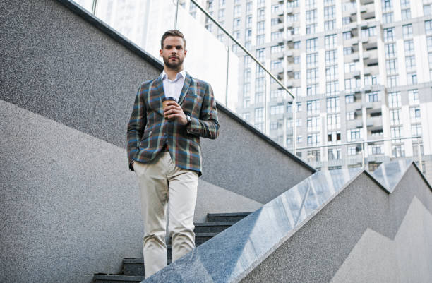 istock Confident businessman having coffee break outdoor 1140555069
