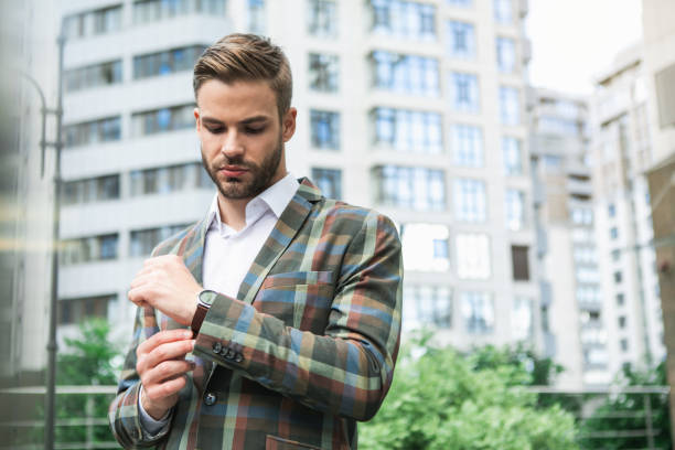 istock Fashionable man using wristwatch outdoor 1140555078