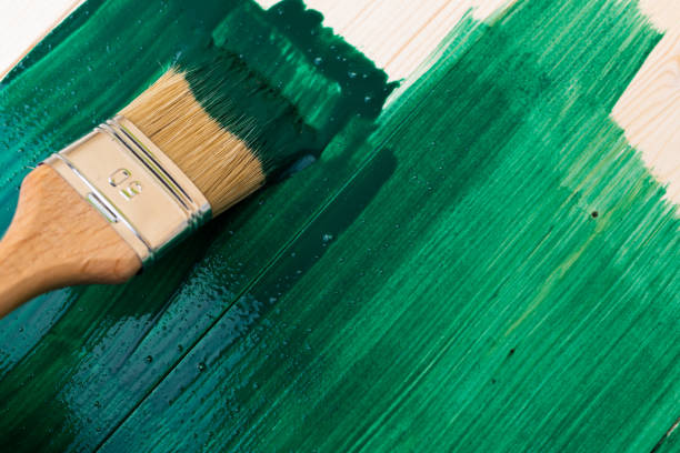 istock Paintin wooden surface with a brush 1140555104