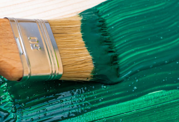 istock Paintin wooden surface with a brush 1140555171