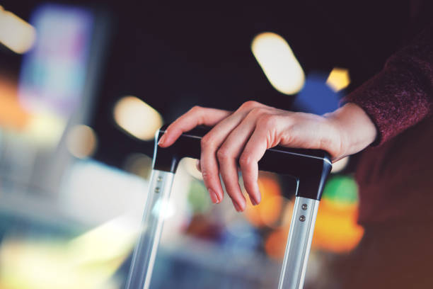 istock Woman carrying suitcase 1140555204