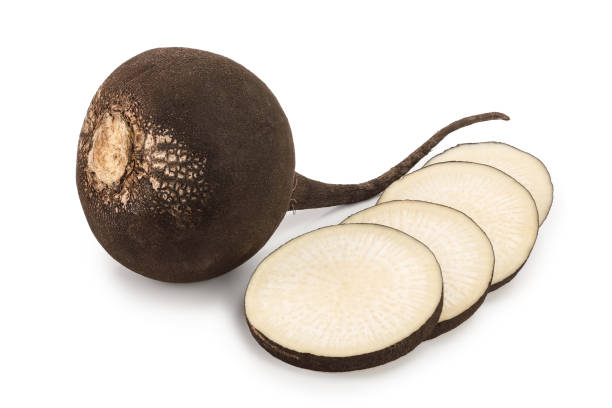 istock Black radish with slices isolated on white background 1140556803