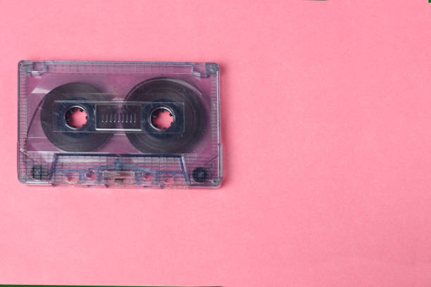 istock Audio retro vintage cassette tape 80s style on pink background 1140561004