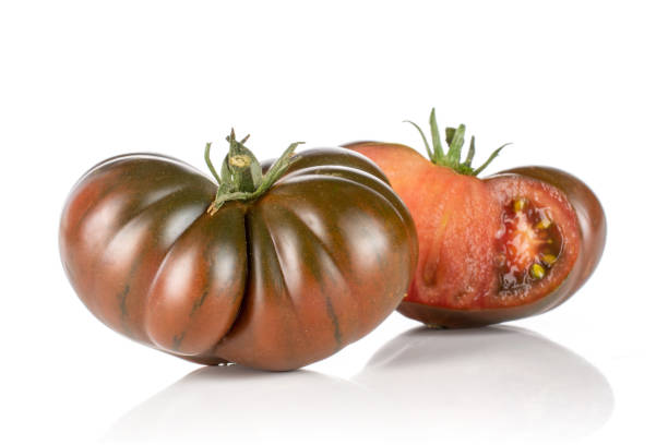 istock Fresh dark tomato primora isolated on white 1140561048