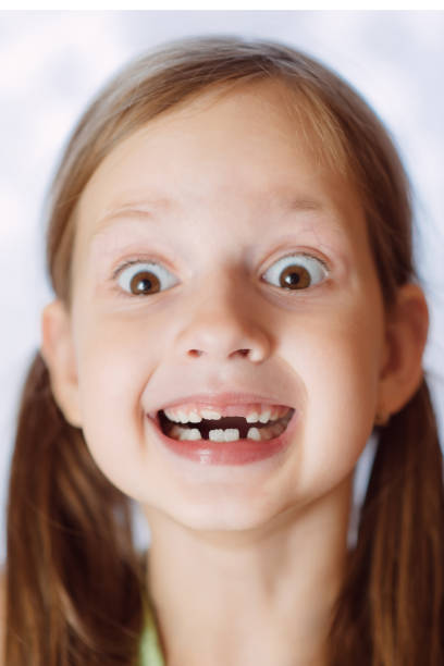 istock funny toothless girl laughing with his mouth open 1140562930