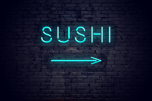 Brick wall with neon arrow and sign sushi stock photo
