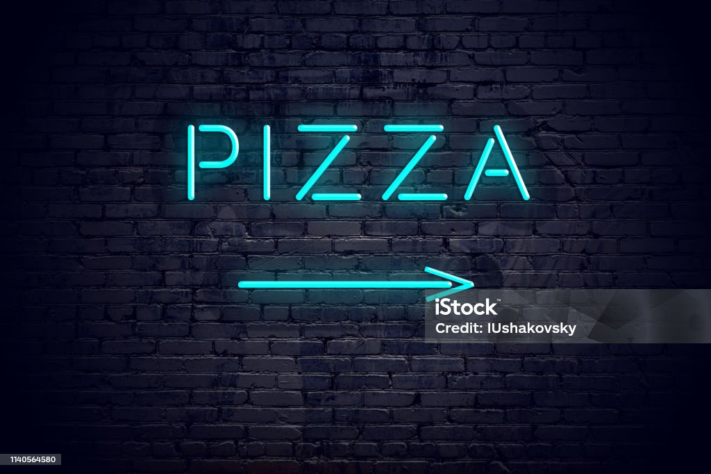 Brick wall with neon arrow and sign pizza Brick Stock Photo