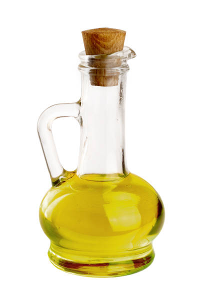 istock A glass bottle with olive oil isolated on a white background 1140566193