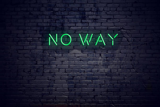 istock Brick wall at night with neon sign no way 1140566215