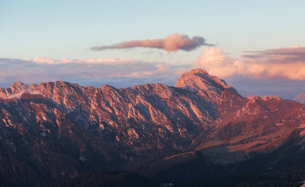 istock Great dolomite mountains with trees below in daily sunlight 1140566343