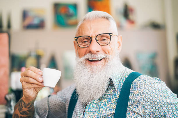 Happy senior drinking coffee in bar - Hipster older male having coffee break - Lifestyle people concept Happy senior drinking coffee in bar - Hipster older male having coffee break - Lifestyle people concept italian ethnicity stock pictures, royalty-free photos & images