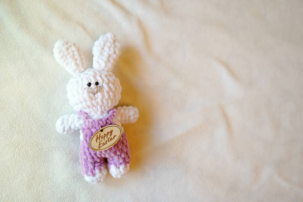 istock Easter bunny on light background with copy space. baby child white toy. tradition, happy easter holiday 1140567531