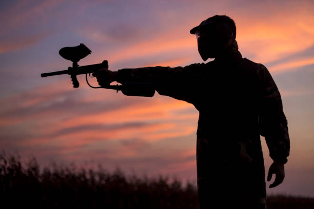 istock Silhouette of a paintball player 1140568985