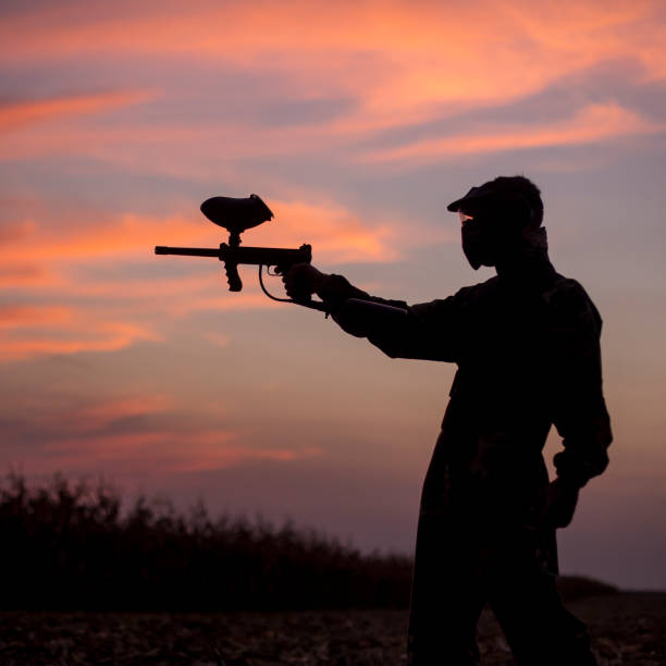 istock Silhouette of a paintball player 1140569031