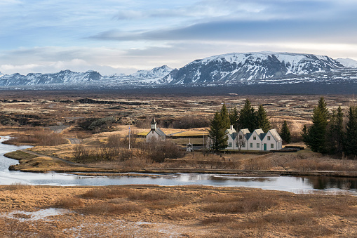 The Thingvellir plain is situated on a tectonic-plate boundary where North America and Europe are tearing away from each other at a rate of 1mm to 18mm per year. As a result, the plain is scarred by dramatic fissures, ponds and rivers, including the great rift Almannagjá (left in the photo).