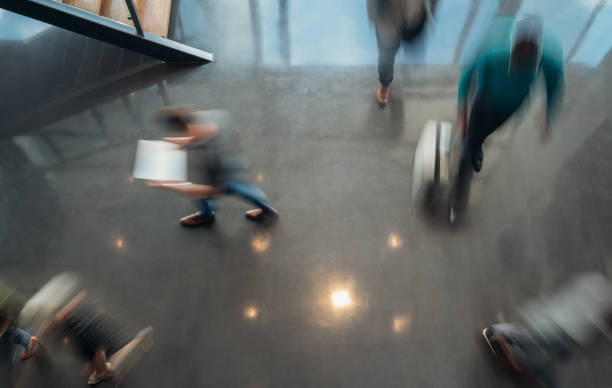 istock Business people walking, blurred by motion shot from a top view 1140570512