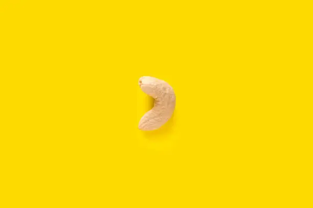 A Cashew nut isolated on yellow background