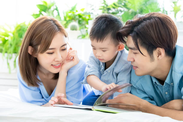 istock Parent read book with child 1140570771